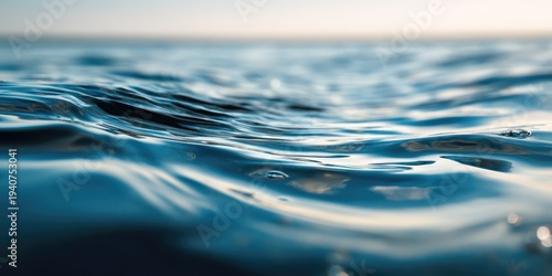 Close-up of clear blue ocean water surface with gentle ripples and reflections.