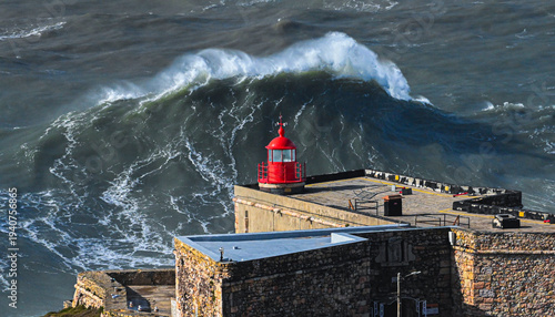 Giant Wave Crest Behind Nazare Lighthouse Portugal