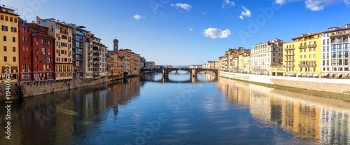 The Ponte Vecchio Historical Stone Arch Old Bridge Panorama over Arno River.  Famous Medieval Tourist Landmark, Sunny Winter Day Florence, Tuscany Italy