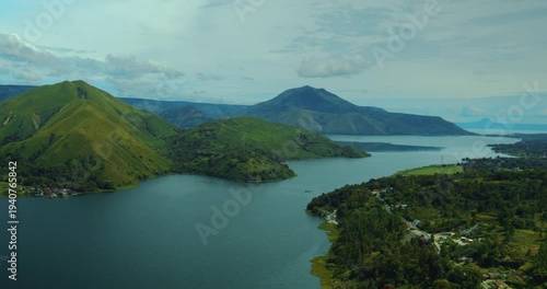 Aerial drone view of tropical mountain hills surrounding Lake Toba