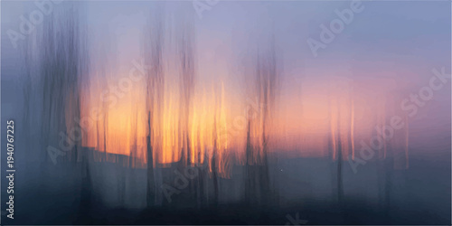 A beautiful summer landscape captures the fiery orange light of a sunset and sunrise over mountains and forest as clouds dance across the glowing evening sky at dusk