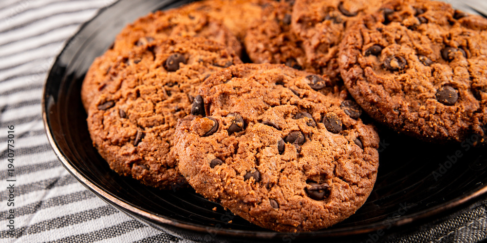 Fototapeta premium Chocolate cookies with chocolate chips sweet dessert homemade baking tasty snack fresh gourmet food background on the table rustic food top view copy space marketing concept photo