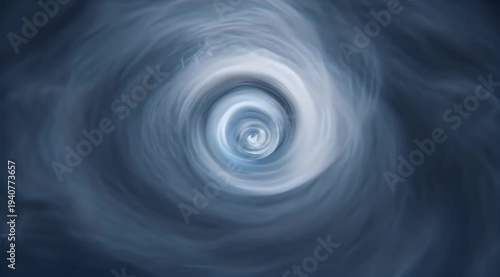 Swirling blue vortex with a bright, nebulous center and hazy, elongated cloud formations