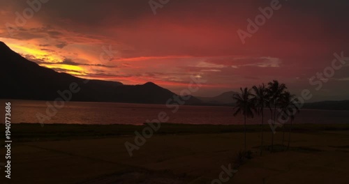 Aerial drone view of Lake Toba volcanic lake during sunset
