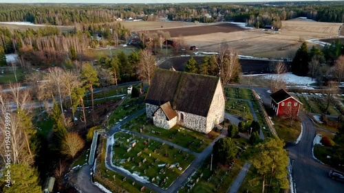 Aerial spring view of the medieval stone church in Rusko, Southwest Finland.