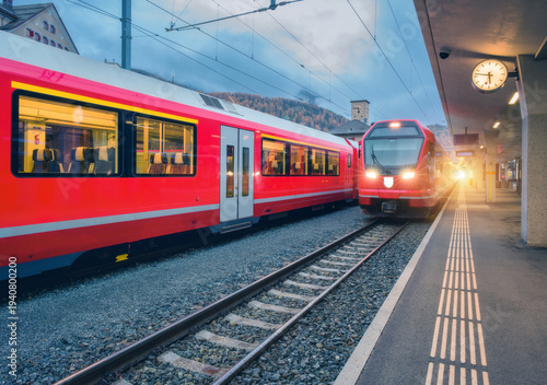 Red modern trains on mounta...