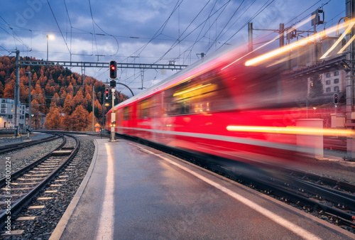 Blurred red passenger train...