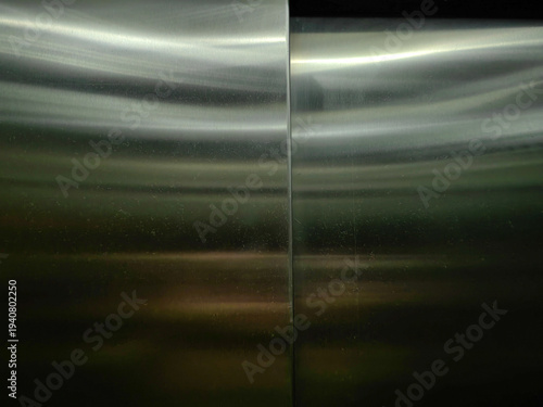 Reflections in Motion – Abstract Light on Elevator Frame.

