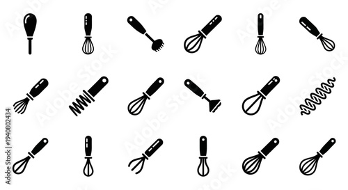A collection of kitchen utensils including whisks, mashers, and spoons arranged neatly on a clean surface, viewed from directly above.