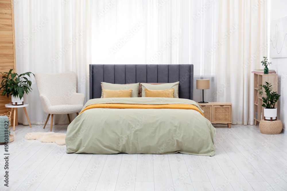 Fototapeta premium Comfortable bed with stylish linens at home. Interior design