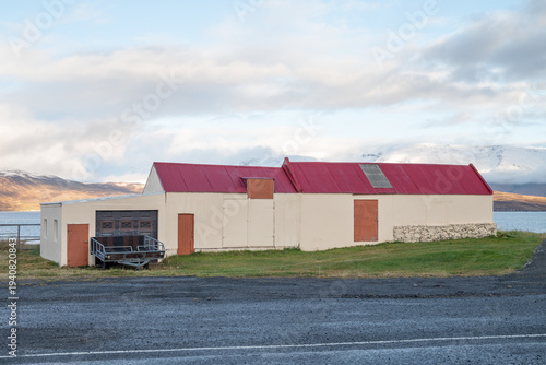 old farm buildings in the village of Hauganes in Iceland