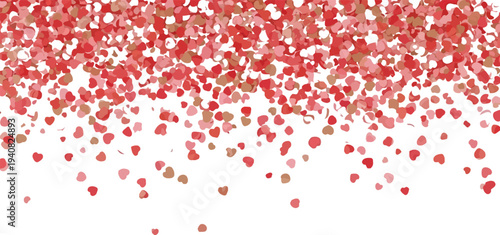 Vibrant red and pink confetti falling on white background