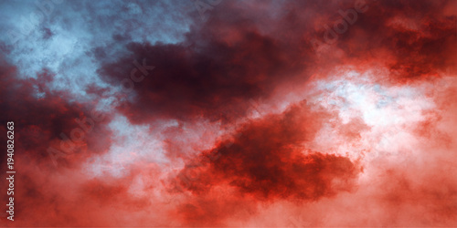 Abstract dramatic sky fills with swirling red clouds, creating a sense of awe and impending drama. A beautiful color palette creates the most intense mood.