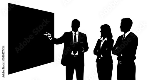 Business team in silhouette giving presentation at a blackboard