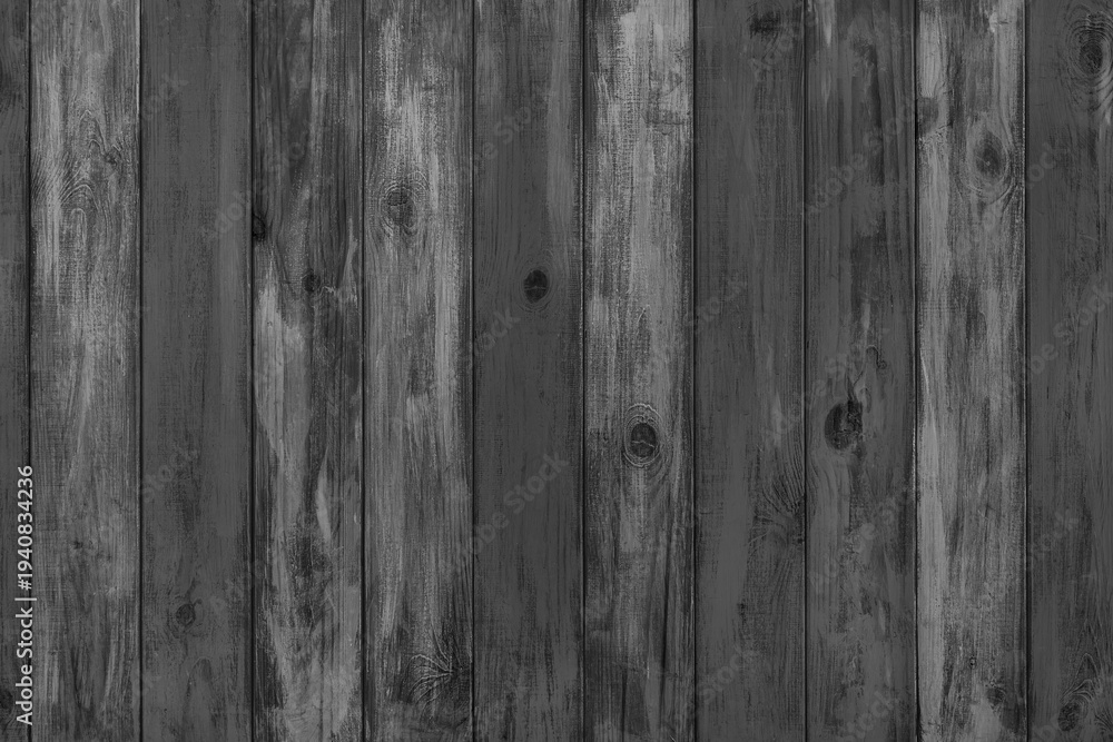 Fototapeta premium Black colored painted wooden board with visible grain and vertical planks, wall wooden surface. Rustic wood texture background, design element, wallpaper, backdrop