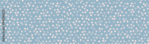 Elegant pastel blue background adorned with a delicate scattering of offwhite dots.