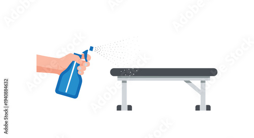 A disembodied hand with light skin holds a blue spray bottle, directing a fine mist of disinfectant onto a dark gray gym bench.