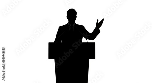 Silhouette of a man speaking at a podium during a presentation.