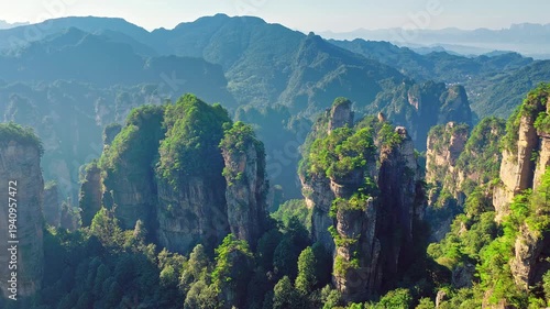 Sandstone pillars and lush green mountains in Zhangjiajie National Forest Park, Hunan, China.
