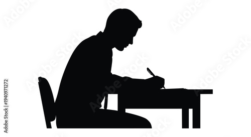 A silhouette of a man seated at a desk writing with a pen
