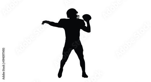 Silhouette of a football player preparing to throw the ball