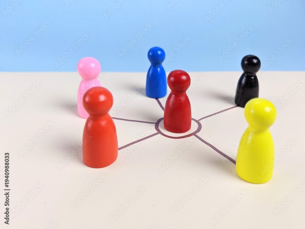 Obraz premium team leader concept. A circle of people surrounds a red person. This depiction represents the essence of business teamwork, showcasing the power of collaboration, team spirit and collective effort.