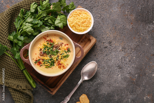 Bowl of tasty cheese soup w...