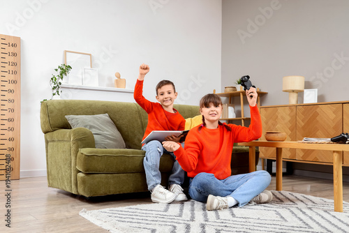 Cute girl playing video gam...