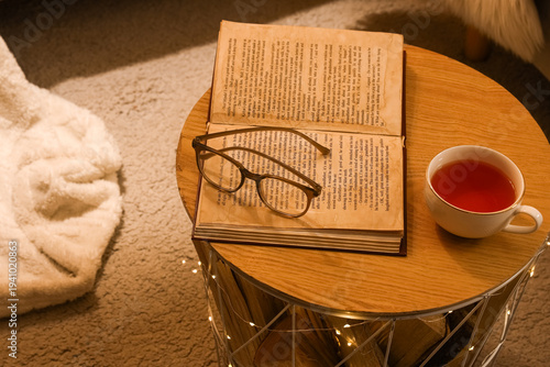 Cup of tea with eyeglasses,...