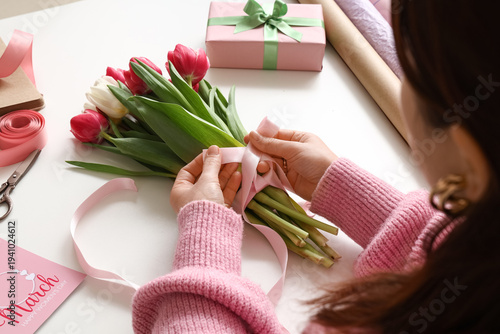 Young woman with gift box a...