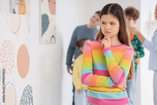 Thoughtful teenage girl loo...