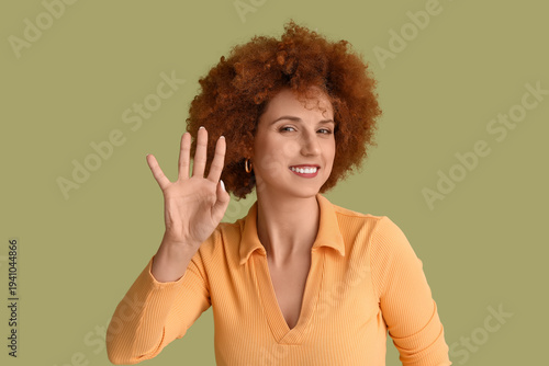 Redhead young woman with cu...