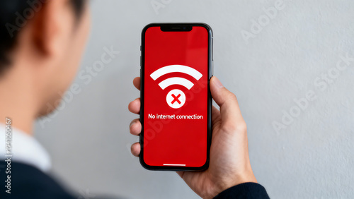 Person holding smartphone with no internet connection error message on red screen, isolated on transparent background
