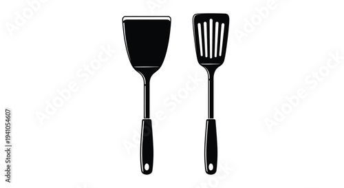 Black spatula and slotted turner kitchen utensils on white background