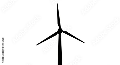 A wind turbine stands tall against a clear sky viewed from a low angle