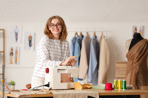 Female tailor with sewing m...