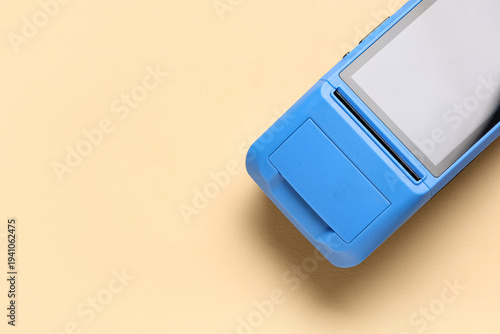 Payment terminal on beige b...