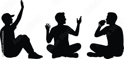 Silhouettes of young men sitting on the ground, talking, gesturing, and drinking from cans, capturing a casual, friendly, and social outdoor gathering scene