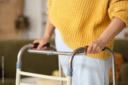 Senior woman with walker at...