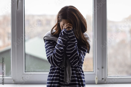 Upset young Asian woman nea...