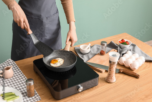 Woman with ingredients fryi...