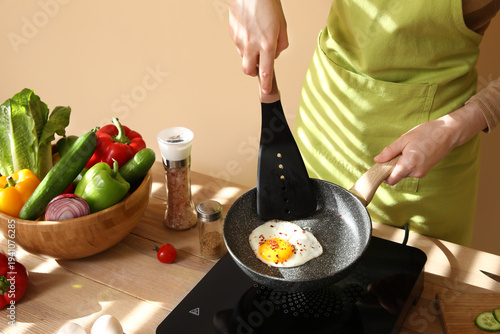 Woman with fresh vegetables...