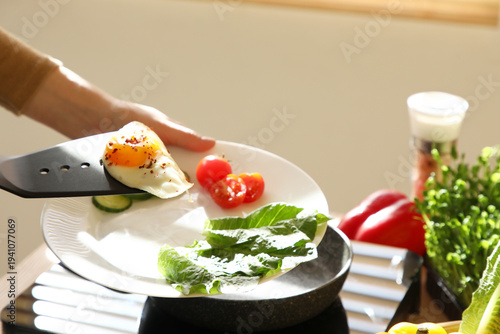Woman putting over fried ch...