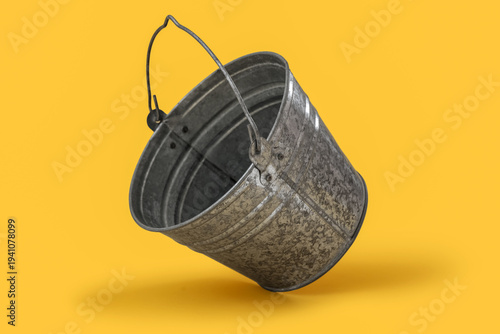 Metal bucket on yellow back...