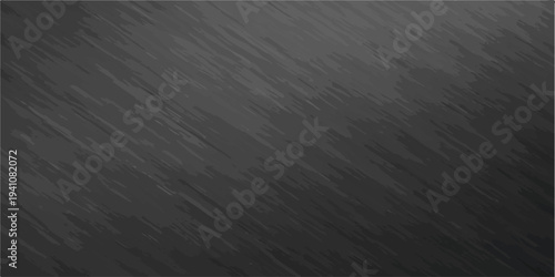 Dark gray brushed metal surface with fine diagonal lines and subtle light