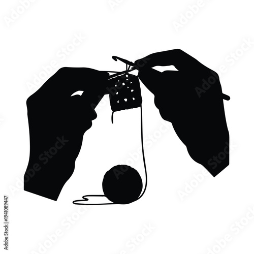 Hands knitting with yarn and needles in a creative process