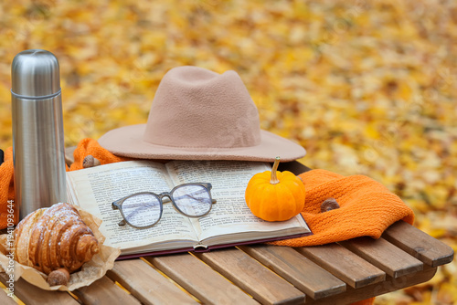 Book with eyeglasses, crois...
