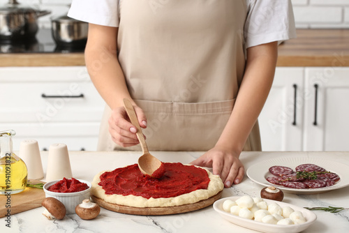 Woman with ingredients spre...