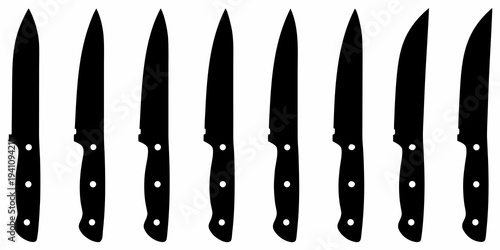 A collection of black silhouette kitchen knives arranged in a row