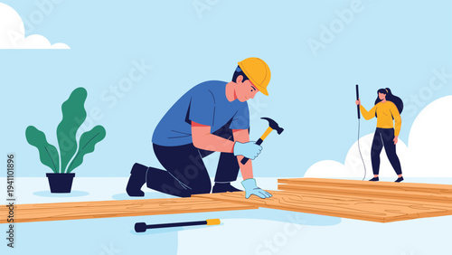 Male construction worker wearing a safety helmet and gloves kneeling to install wooden floor boards with a metal hammer.